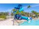 Community water slide and pool area with palm trees at 1933 Darlin Cir, Orlando, FL 32820