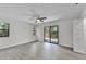 Spacious bedroom with wood-look flooring, natural light, and closet space at 2 Rollingwood Trl, Deland, FL 32724