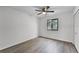 Bedroom with a ceiling fan, closet, and wood-look floors offers a comfortable retreat at 2 Rollingwood Trl, Deland, FL 32724