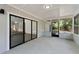 Enclosed patio with screens offers views of the living room at 2 Rollingwood Trl, Deland, FL 32724