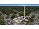 An aerial view shows the property nestled in a neighborhood with mature trees, offering a serene environment at 229 Bitterwood St, Winter Springs, FL 32708