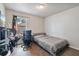 Bright bedroom with a bed, desk, chair, and window at 229 Bitterwood St, Winter Springs, FL 32708