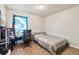 Bright bedroom with a bed, desk, chair, and window at 229 Bitterwood St, Winter Springs, FL 32708