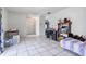 Bright bedroom featuring tile floor, and an adjacent doorway at 229 Bitterwood St, Winter Springs, FL 32708
