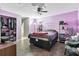 Spacious bedroom has closet, shelves, and relaxing chair at 229 Bitterwood St, Winter Springs, FL 32708