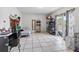 Open bedroom features tiled floors, a mirror, and a sliding glass door at 229 Bitterwood St, Winter Springs, FL 32708