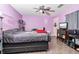 Spacious bedroom has ceiling fan, closet, and entertainment center at 229 Bitterwood St, Winter Springs, FL 32708