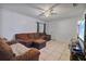 Living room with comfortable furniture, tiled flooring and a view of a large television screen at 229 Bitterwood St, Winter Springs, FL 32708