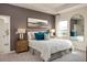 Serene main bedroom with contemporary design, plush bedding, and stylish accents at 2500 Raghav Trail Cir, Tavares, FL 32778