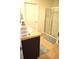 Bathroom featuring a walk-in shower and granite countertops at 3074 Royal Tern Dr, Winter Haven, FL 33881