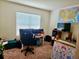 Bright bedroom with a large window and neutral carpet, ideal for relaxation and rest at 3074 Royal Tern Dr, Winter Haven, FL 33881