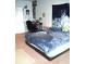 Bedroom with personal touches and a wave tapestry at 3074 Royal Tern Dr, Winter Haven, FL 33881