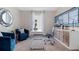 Comfortable office space featuring blue chairs, a sleek desk, and natural light at 3141 Partington Blvd, Davenport, FL 33837