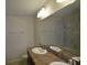 Bathroom featuring a double sink vanity, large mirror and shower/tub combo at 3308 Rodrick Cir, Orlando, FL 32824