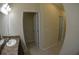 Bathroom with a single sink vanity, a large mirror, and white trims at 3308 Rodrick Cir, Orlando, FL 32824