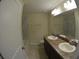 Bathroom featuring a double sink vanity, large mirror and shower/tub combo at 3308 Rodrick Cir, Orlando, FL 32824