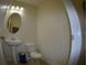 Stylish half bath features a pedestal sink and modern fixtures at 3308 Rodrick Cir, Orlando, FL 32824
