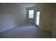 Bright bedroom with natural light with a door leading to an outdoor balcony at 3308 Rodrick Cir, Orlando, FL 32824