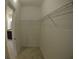 Walk-in closet with shelving and carpeted flooring, providing ample storage space at 3308 Rodrick Cir, Orlando, FL 32824