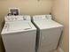 Convenient laundry room featuring a white washer and dryer set at 3308 Rodrick Cir, Orlando, FL 32824