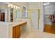 Bright bathroom featuring a glass shower, double sink vanity, and access to a walk-in closet at 3372 Bellington Dr, Orlando, FL 32835