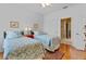 Bedroom with two beds, colorful rugs, and doorway to bathroom at 3372 Bellington Dr, Orlando, FL 32835
