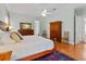 Bedroom featuring hardwood floors, a ceiling fan, and a large bed with nightstands at 3372 Bellington Dr, Orlando, FL 32835
