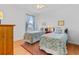 Bedroom with two beds, colorful rugs, and accent lamps at 3372 Bellington Dr, Orlando, FL 32835