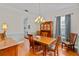 Cozy dining room with wood table, chandelier, and cabinet at 3372 Bellington Dr, Orlando, FL 32835