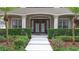 Attractive front entrance with a double door entry and well-manicured hedges and landscaping at 3372 Bellington Dr, Orlando, FL 32835