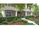 Inviting home featuring beautiful front yard landscaping and a grand entrance with large windows at 3372 Bellington Dr, Orlando, FL 32835