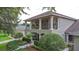 Elegant two-story home with an inviting front balcony and meticulously landscaped front yard at 3372 Bellington Dr, Orlando, FL 32835