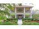 Charming two-story home featuring a welcoming front porch and lush, well-maintained landscaping at 3372 Bellington Dr, Orlando, FL 32835
