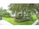 A beautiful home featuring manicured landscaping and a well-maintained lawn at 3372 Bellington Dr, Orlando, FL 32835