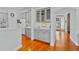 Elegant kitchen featuring gray cabinets, hardwood floors, and butler's pantry at 3372 Bellington Dr, Orlando, FL 32835