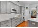 Updated kitchen with gray cabinets, white countertops, and stainless steel appliances at 3372 Bellington Dr, Orlando, FL 32835