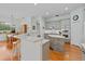 Kitchen with gray cabinets, island with breakfast bar and stainless steel appliances at 3372 Bellington Dr, Orlando, FL 32835