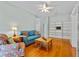 Living room with hardwood floors, built-in shelves, and neutral paint at 3372 Bellington Dr, Orlando, FL 32835