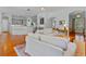 Spacious living room with hardwood floors and open layout that flows into the kitchen area at 3372 Bellington Dr, Orlando, FL 32835