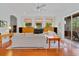 Bright living room with hardwood floors, fireplace, and sliding glass doors to the outdoor space at 3372 Bellington Dr, Orlando, FL 32835