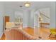 Bright living room featuring hardwood floors, elegant archways, and easy access to other rooms at 3372 Bellington Dr, Orlando, FL 32835