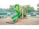Community playground featuring a fun green spiral slide, climbing structures, and safety surfacing at 3372 Bellington Dr, Orlando, FL 32835