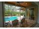 Enjoy the screened pool area with a ceiling fan, and a built-in hot tub with easy access to the house at 3372 Bellington Dr, Orlando, FL 32835