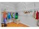 Spacious walk-in closet with custom shelving and ample hanging space for organized storage at 3372 Bellington Dr, Orlando, FL 32835