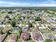 A vast neighborhood with homes, pools, and greenery is captured in a scenic aerial view at 340 Edgewood Ct, Kissimmee, FL 34759