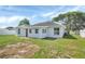 Private backyard with lawn, mature trees, and fencing offers a relaxing outdoor space at 340 Edgewood Ct, Kissimmee, FL 34759