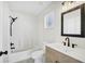Modern bathroom with stylish vanity, updated fixtures, and a shower-tub combo at 340 Edgewood Ct, Kissimmee, FL 34759