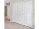 Large closet doors with wood-look flooring and neutral walls at 340 Edgewood Ct, Kissimmee, FL 34759