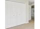 Large closet doors with wood-look flooring and neutral walls at 340 Edgewood Ct, Kissimmee, FL 34759