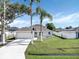 A charming single-Gathering home with a well-maintained lawn and a two car garage at 340 Edgewood Ct, Kissimmee, FL 34759